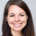 Smiling Laurence Boitet, PhD poses for a professional headshot